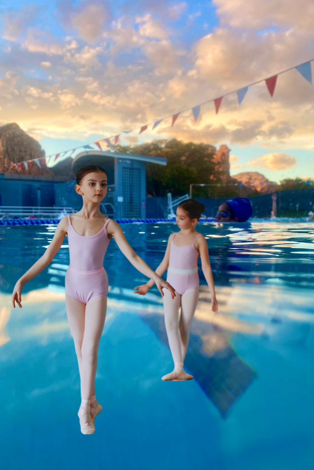 Two ballerinas dancing on water